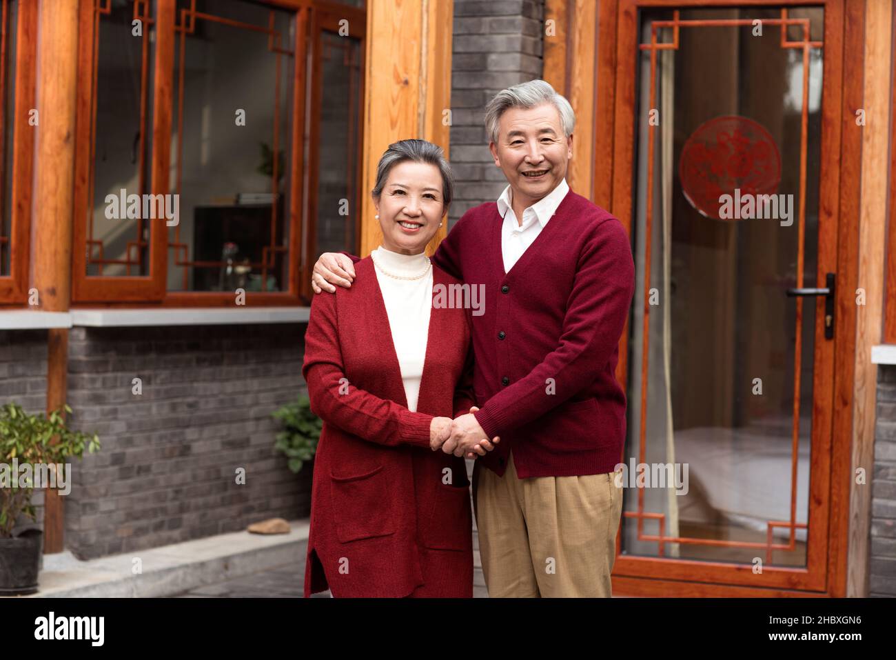 Old couple celebrating New Year Stock Photo