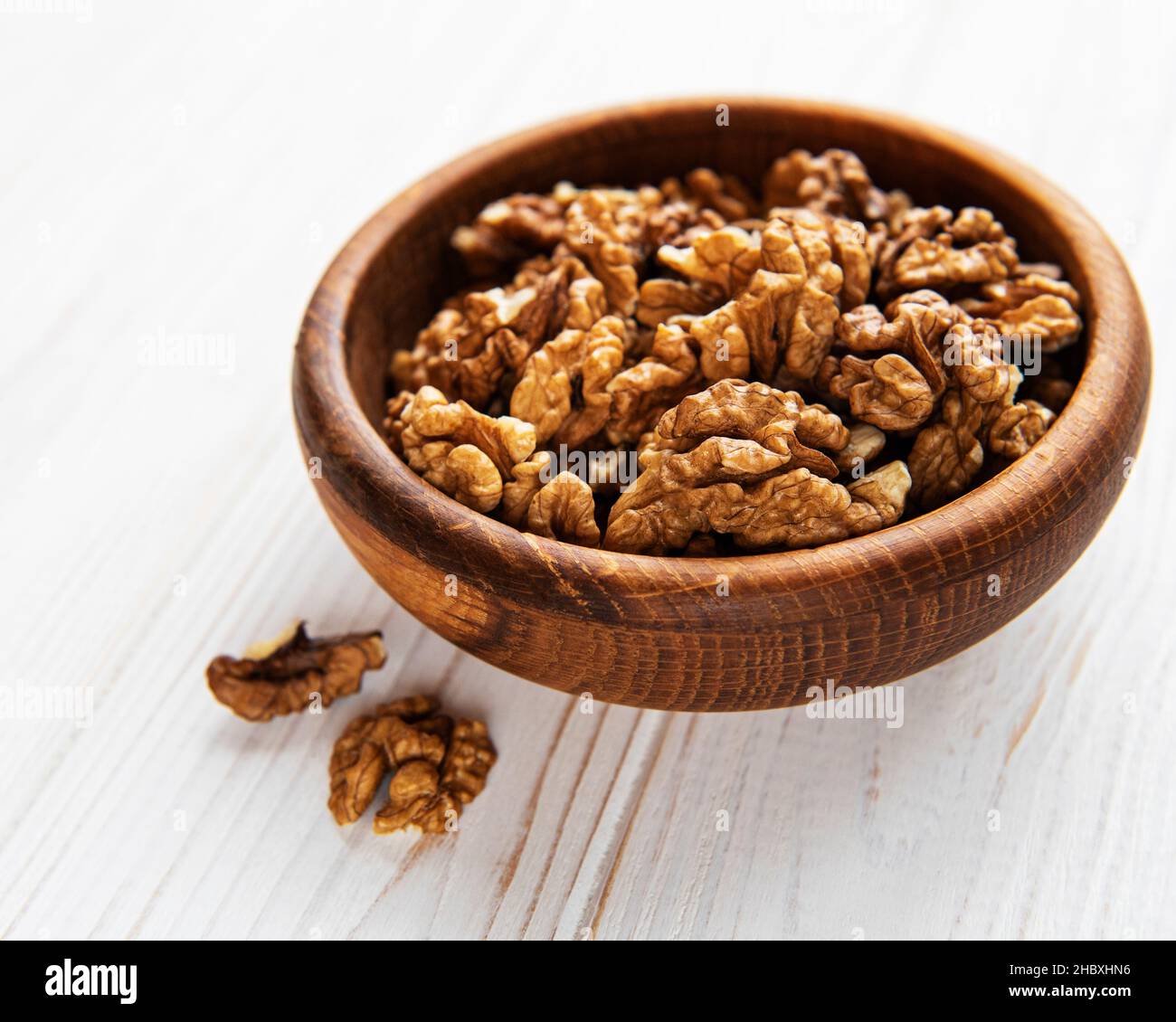 Walnuts  without shell on a white wooden background Stock Photo