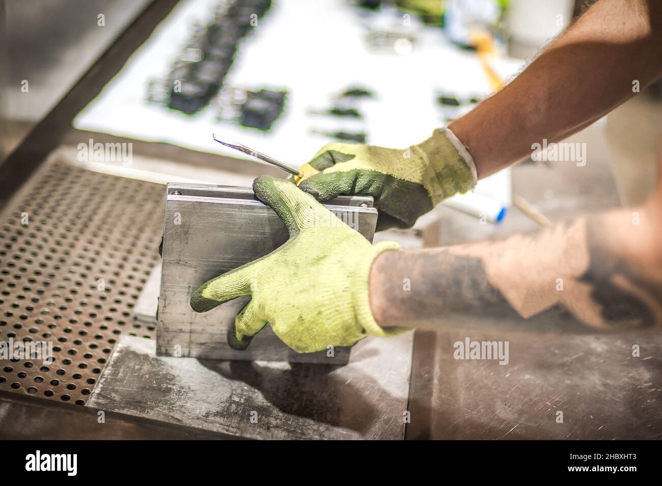 Professional worker technician work with soft PVC liquid rubber in mold