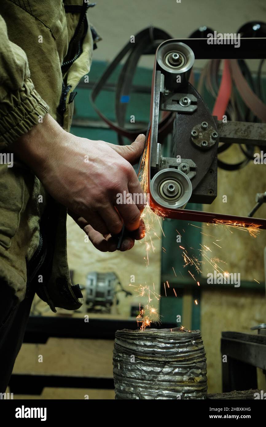 Sparks grinding wheel while knife sharpening. Stock Photo