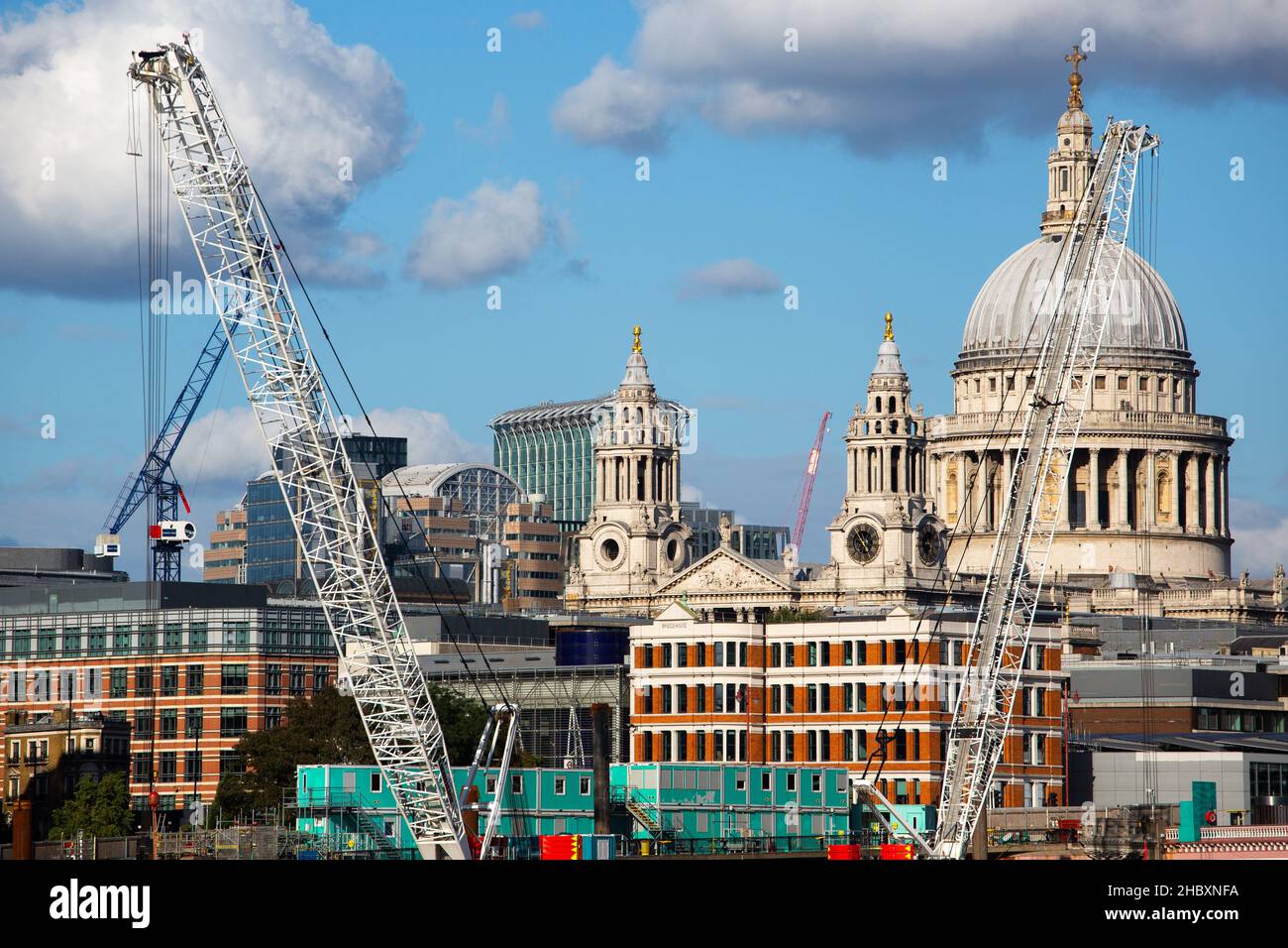 classic view of London with St.Pauls dome and construction cranes , blue skies and big clouds Stock Photo
