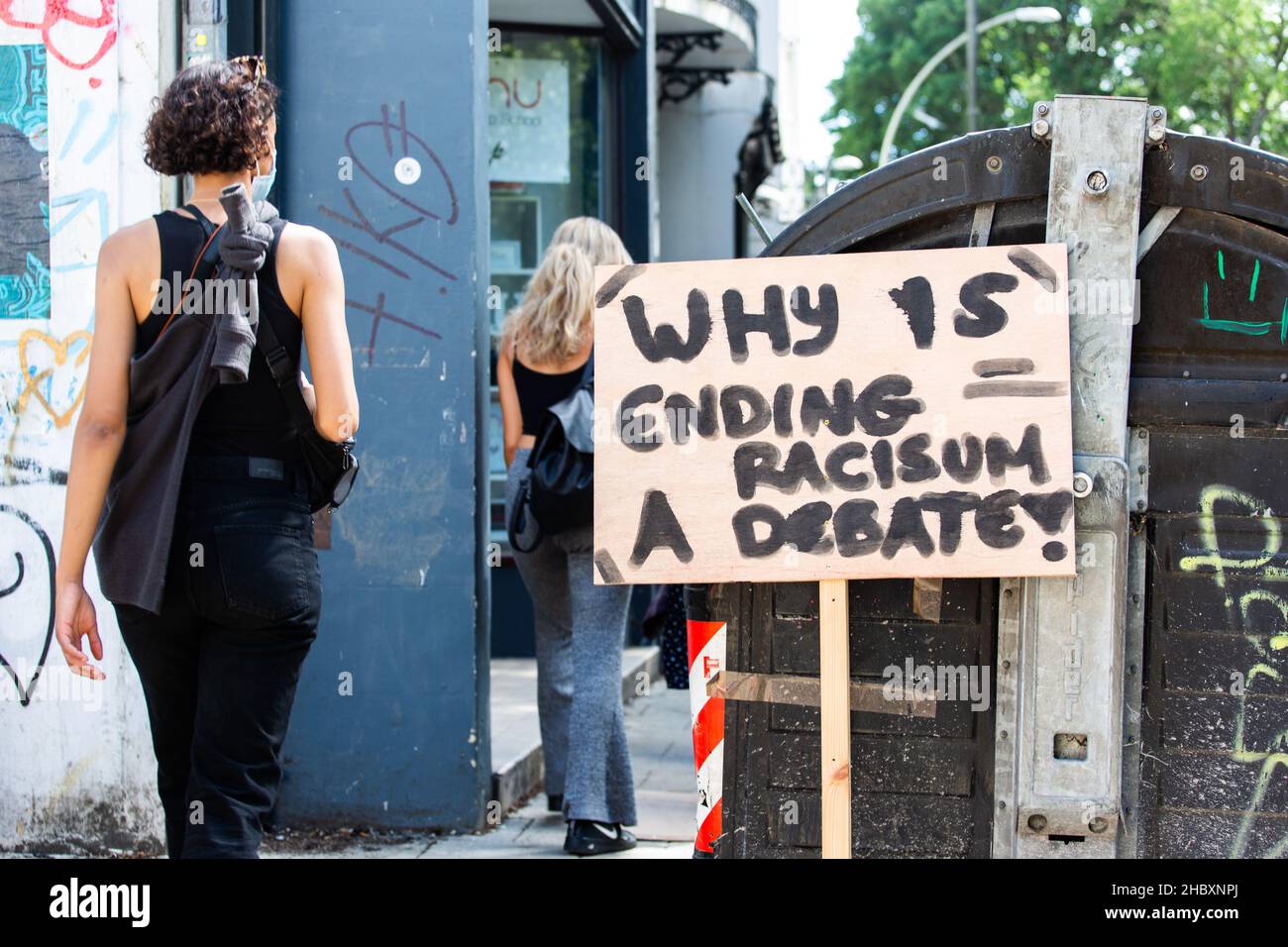 why s ending racism a debate placard in Brighton 2020 Stock Photo