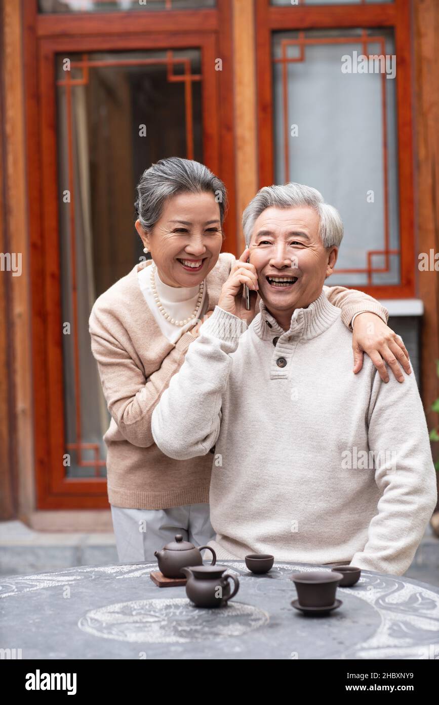 Old couple using a smartphone Stock Photo