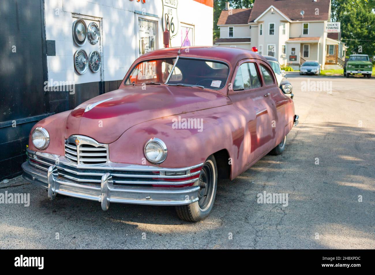 vintage 1948 Packard sedan Plymouth police car parked outside the
