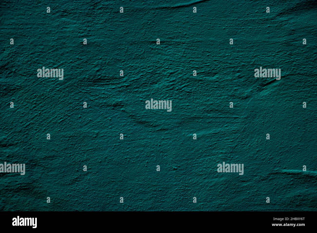 Petrol colored wall background with textures of different shades of ...