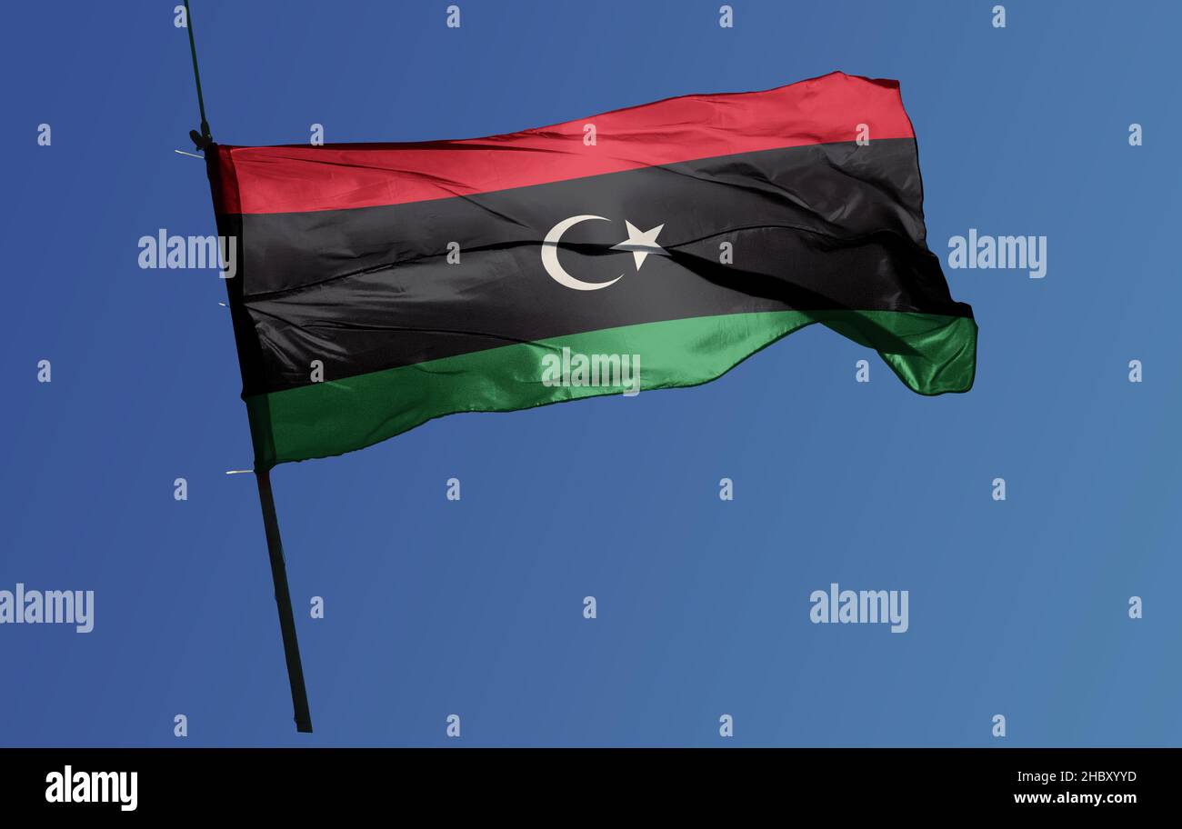 The flag of Libya was originally introduced in 1951, following the creation of the Kingdom of Libya. Stock Photo