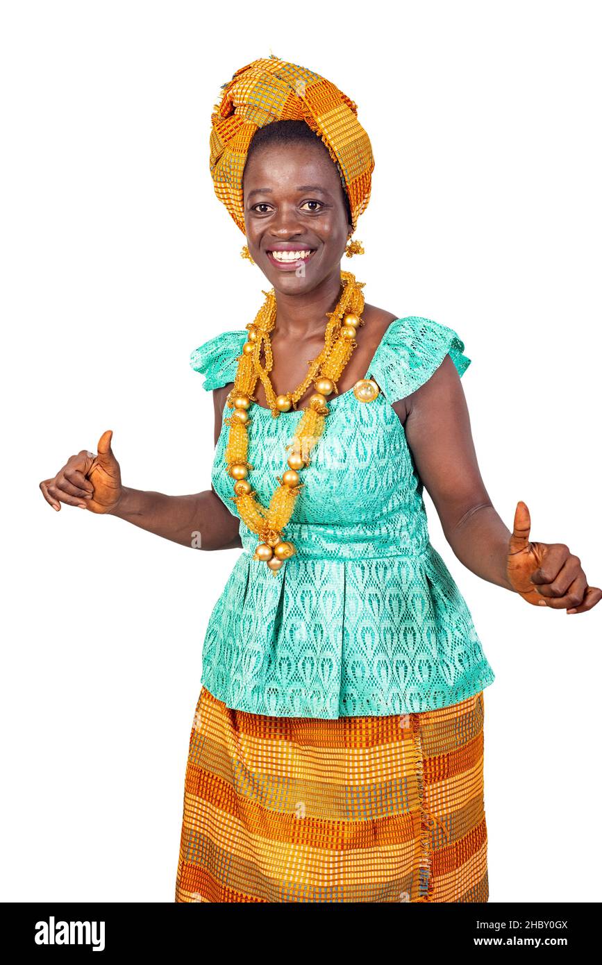 a beautiful young African woman in traditional dress standing on white ...