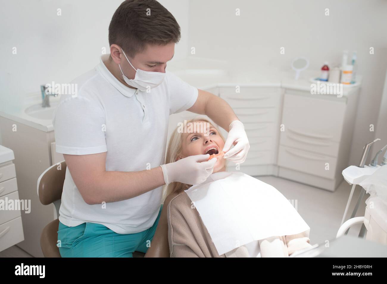 Dental surgeon making teeth replacement procedure Stock Photo
