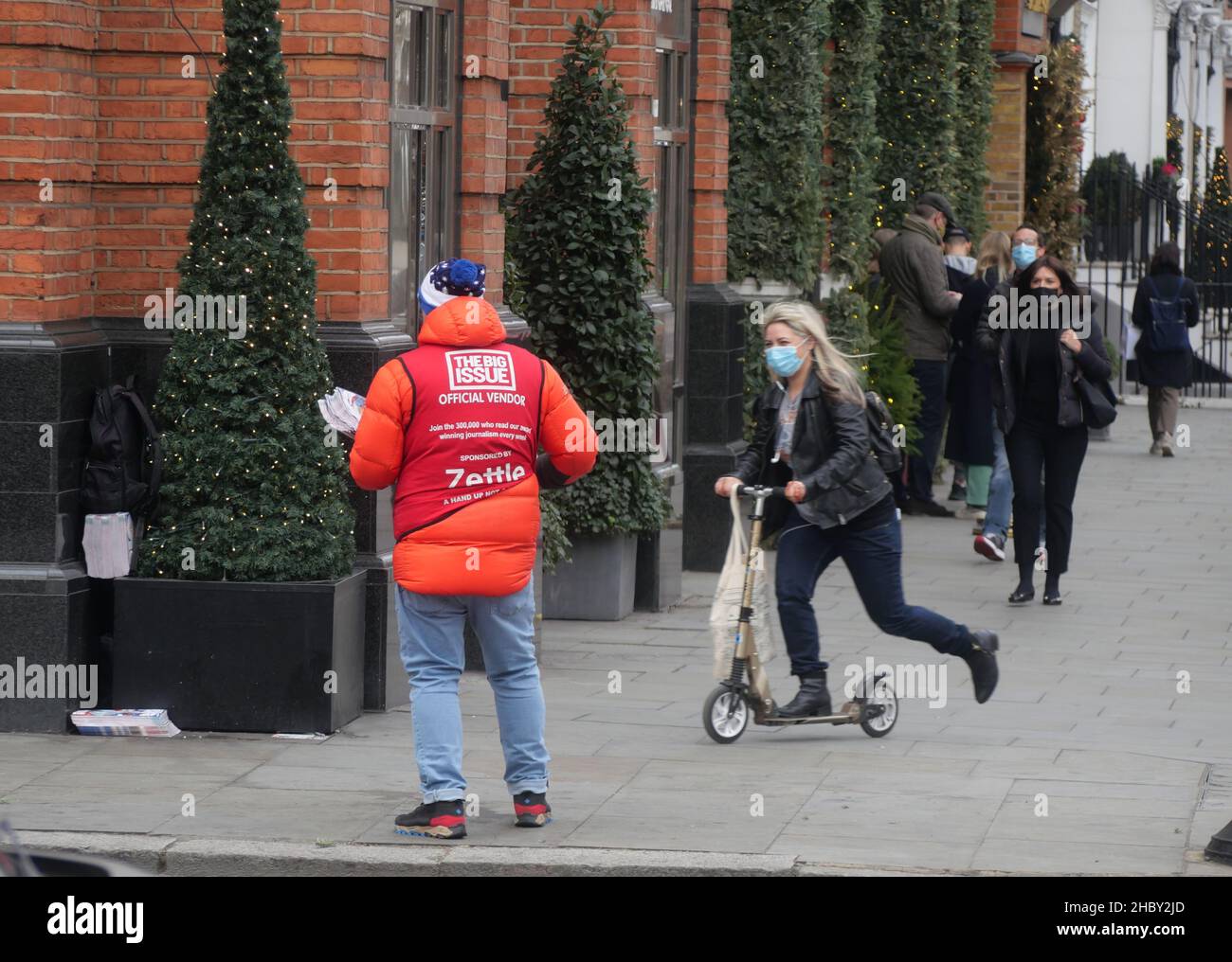London.UK. December 22nd 2021.Big Issue sellers plead for support as streets empty ahead of Christmas. Credit: Brian Minkoff/Alamy Live News Stock Photo