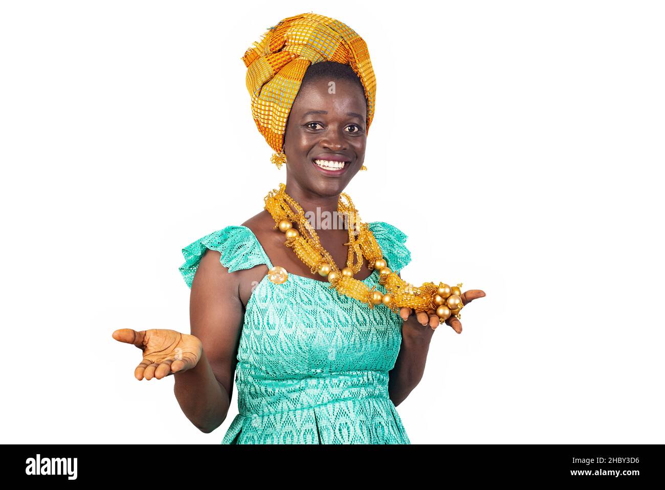 a beautiful young African woman in traditional dress standing on white ...