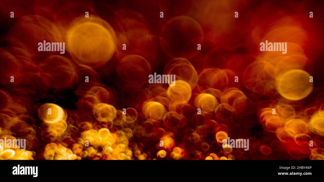 Fire embers particles over black background. Fire sparks background. Stock Photo