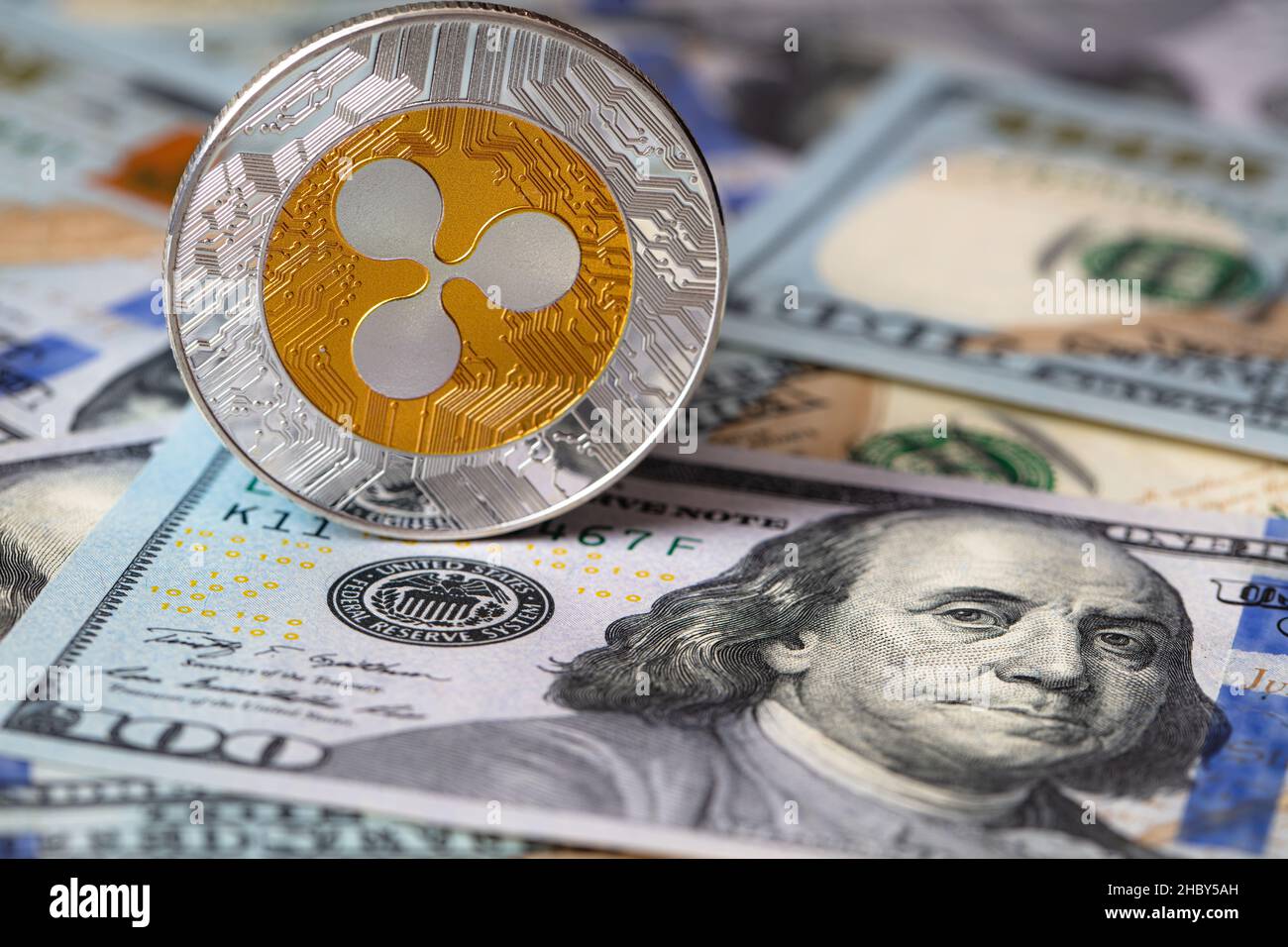 Ripple coin, XRP token, cryptocurrency on US 100 dollar background for ...