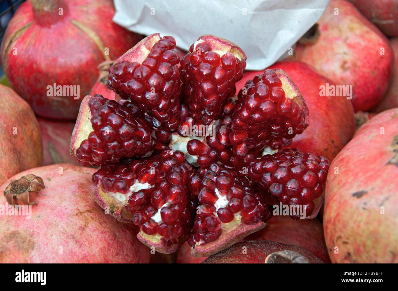 Ripe pomegranate cut open and star-shaped, pomegranates with fruit cut open Stock Photo