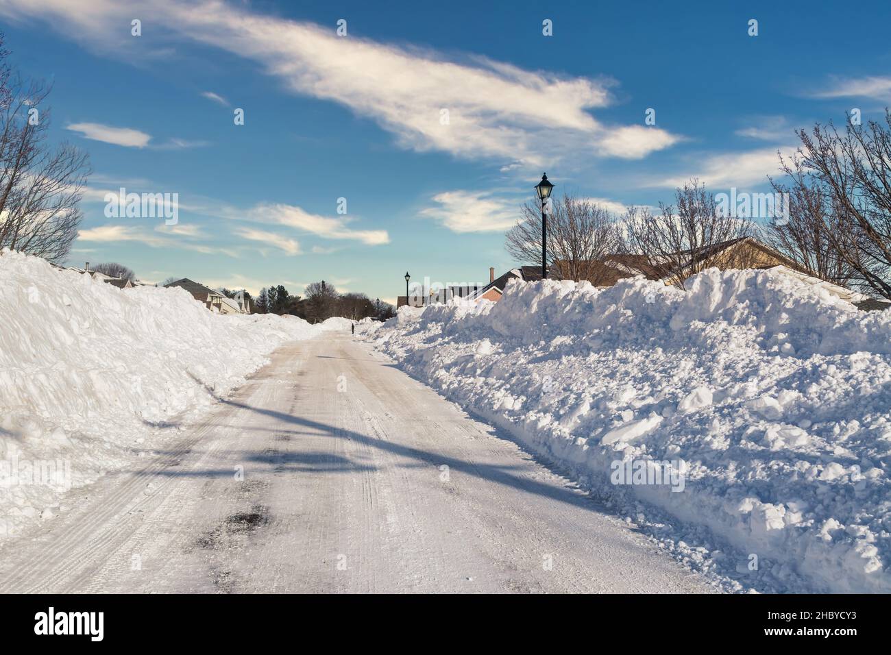 Plowed road through a subdivision after a storm. Stock Photo