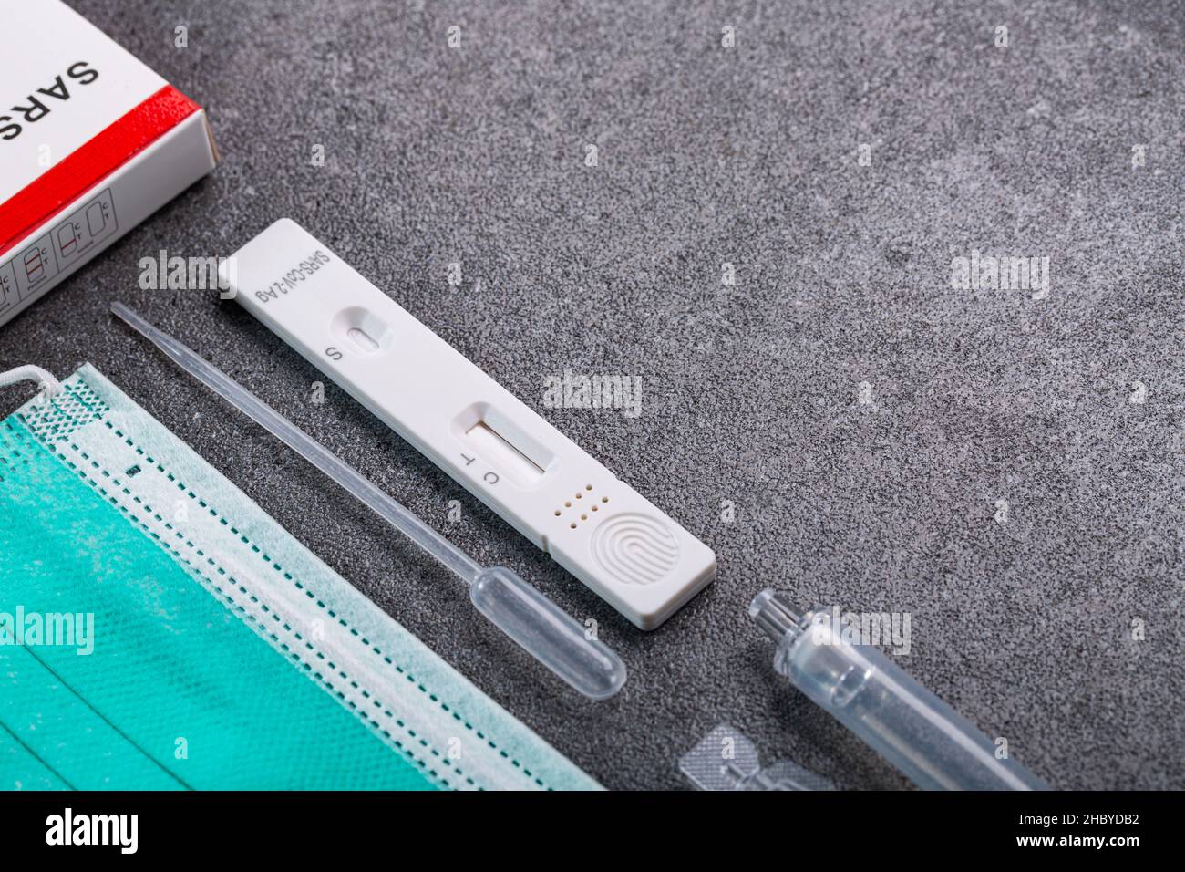 Saliva antigen test kit with copy space for check coronavirus