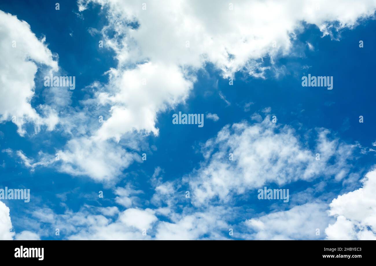 Vivid blue sky with group of white clouds Stock Photo - Alamy