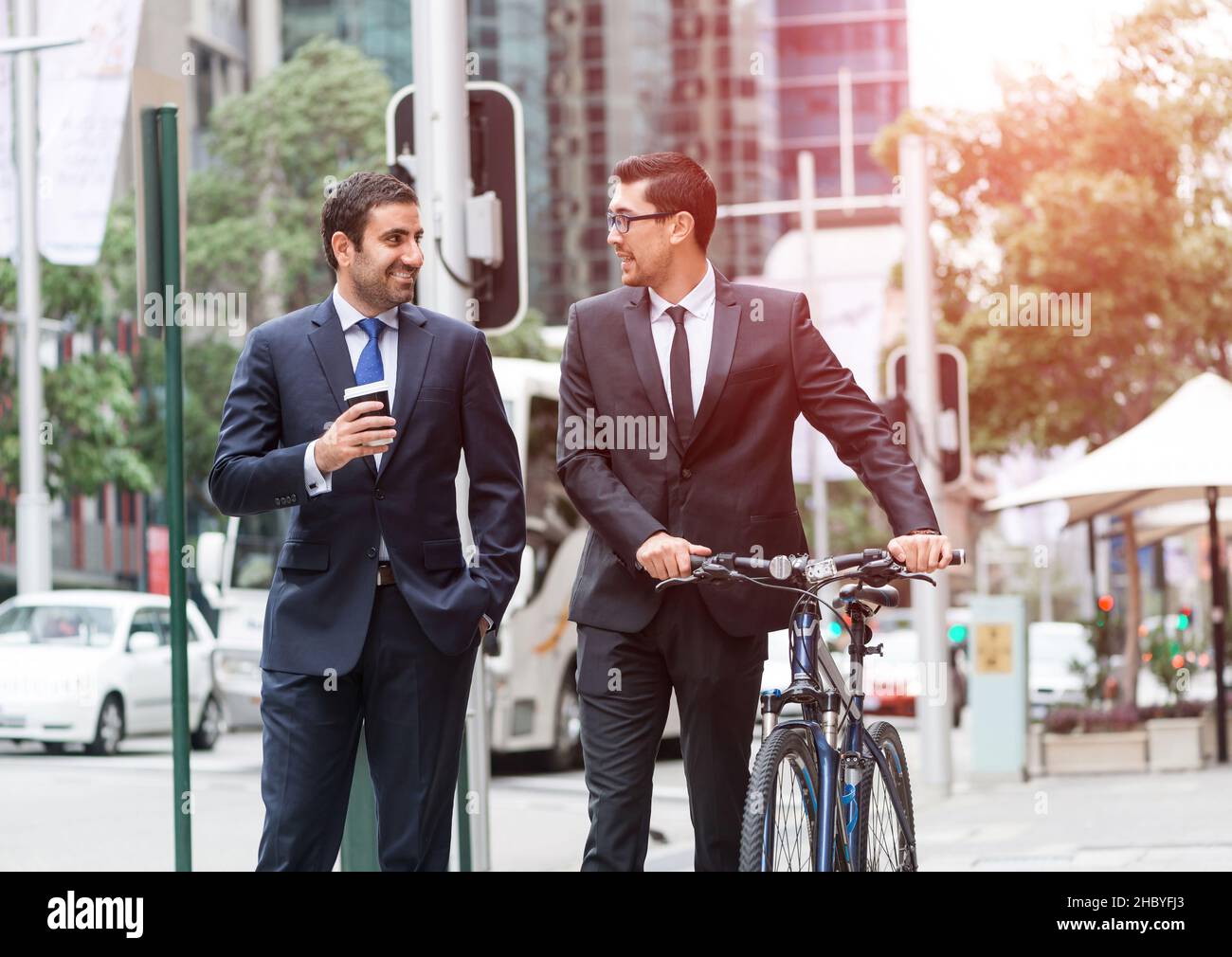 Two businessmen having walk Stock Photo - Alamy