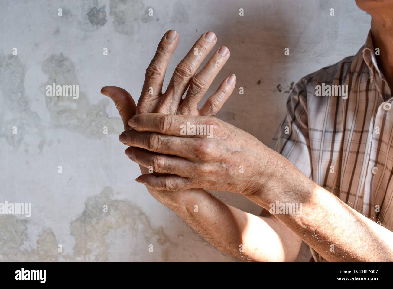 Asian elder man’s fingers and hand. Concept of hand pain, arthritis and