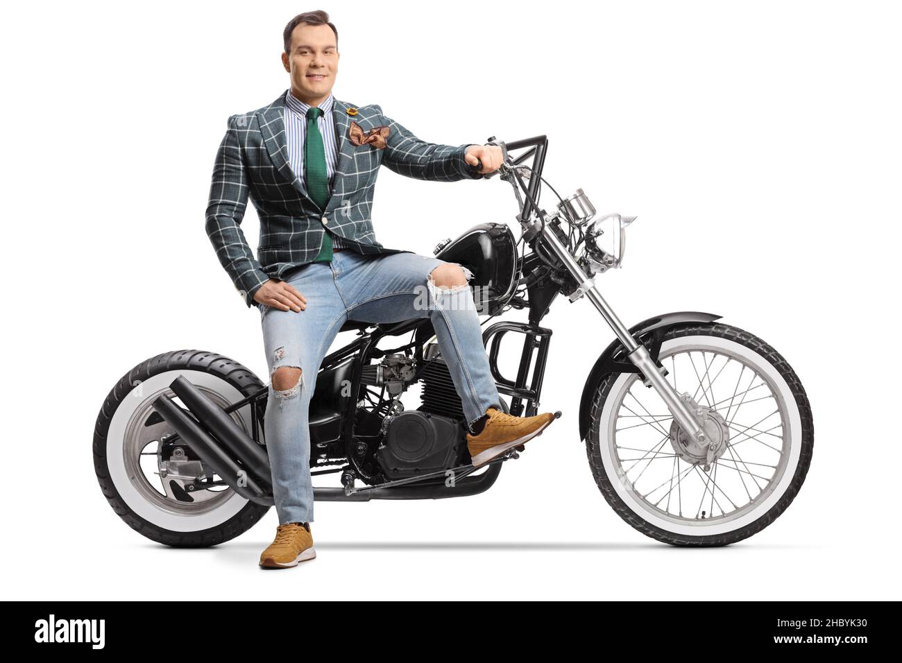 Man in stylish clothes sitting on a chopper motorbike isolated on white  background Stock Photo - Alamy