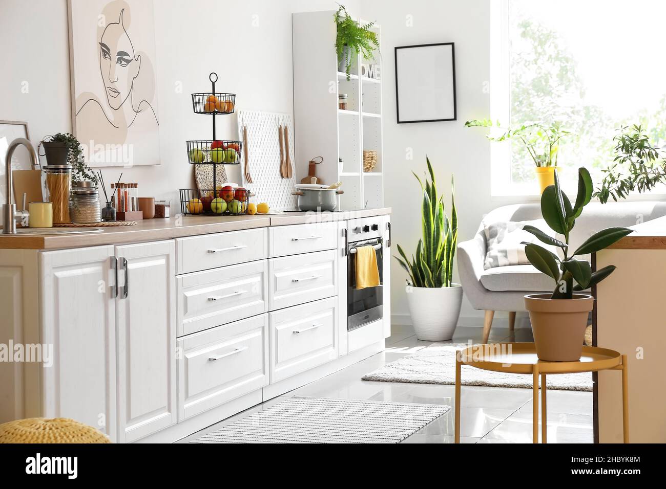 Interior of light kitchen with white counters and healthy food Stock ...