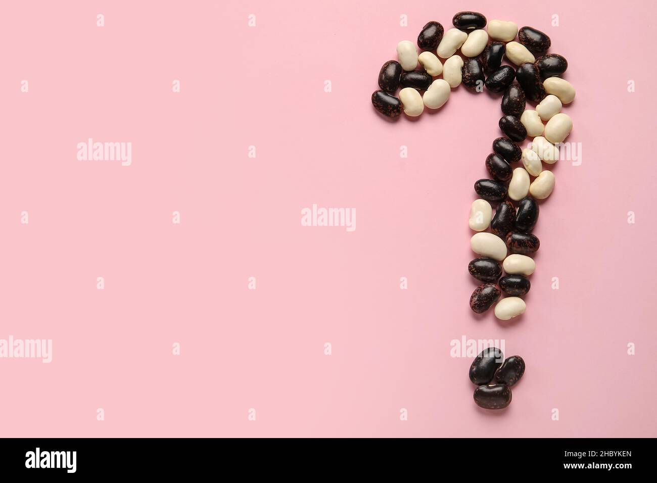 Question mark made of raw beans on pink background Stock Photo - Alamy