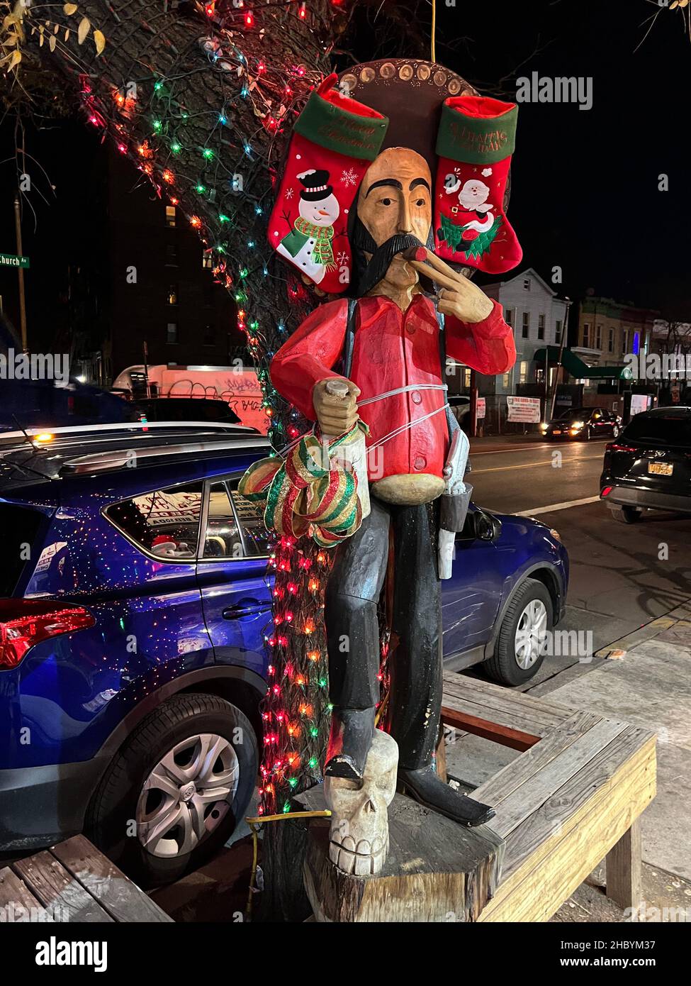Mexican bandito sculpture outside a bodega in Brooklyn showing the Christmas spirit Stock Photo