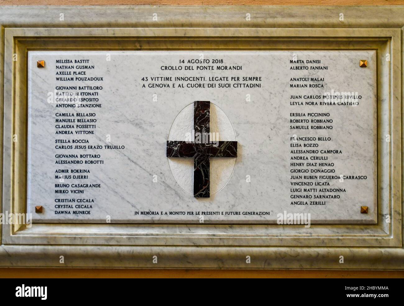 Memorial plaque dedicated to the victims of the collapse of Ponte Morandi (2018), on a wall of the entrance of the town hall of Genoa, Liguria, Italy Stock Photo