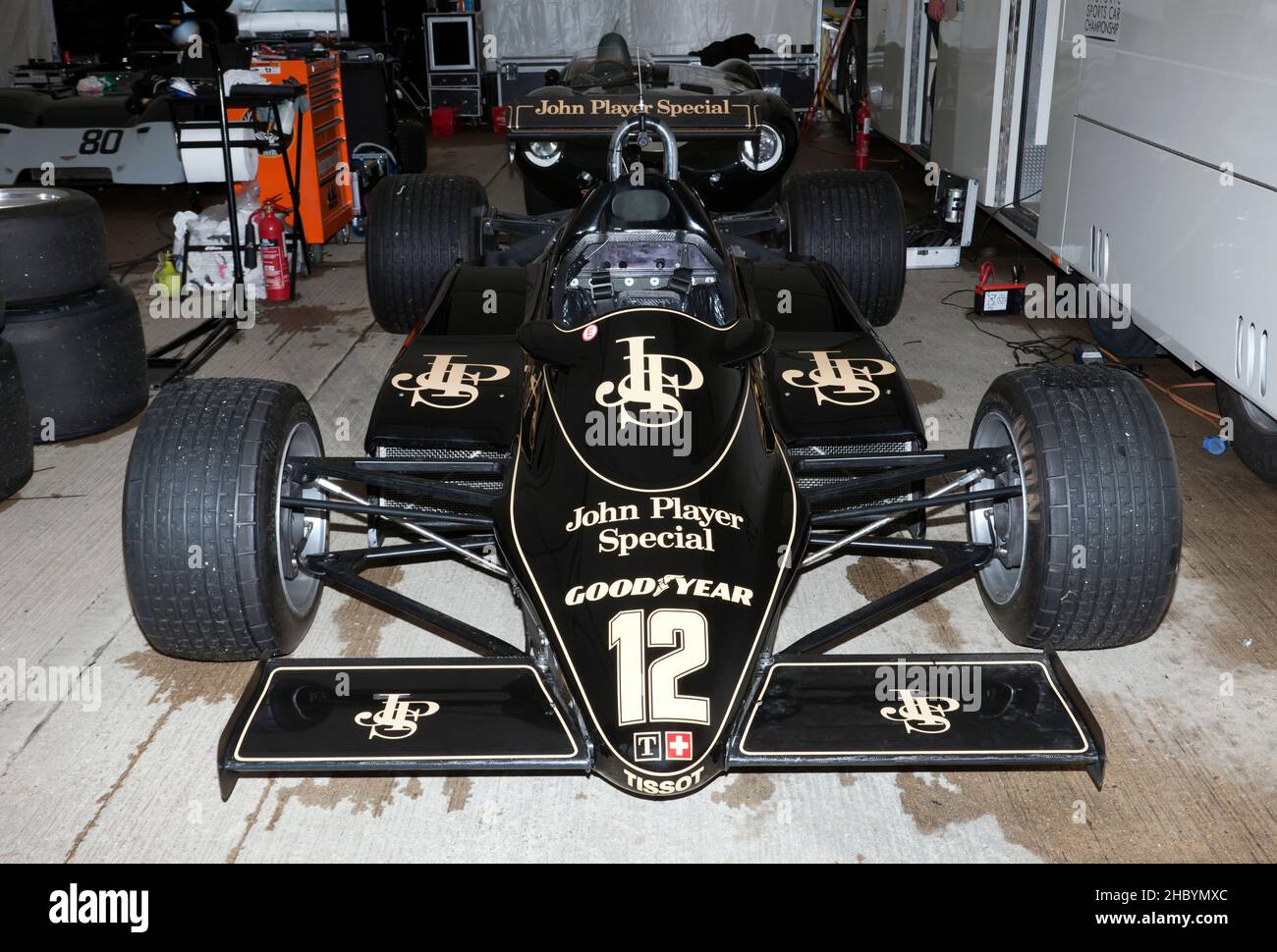 Steve Brooks 1982, Black, Lotus 91, in its temporary Pit Garage, in the International Paddock, at the 2021 Silverstone Classic Stock Photo