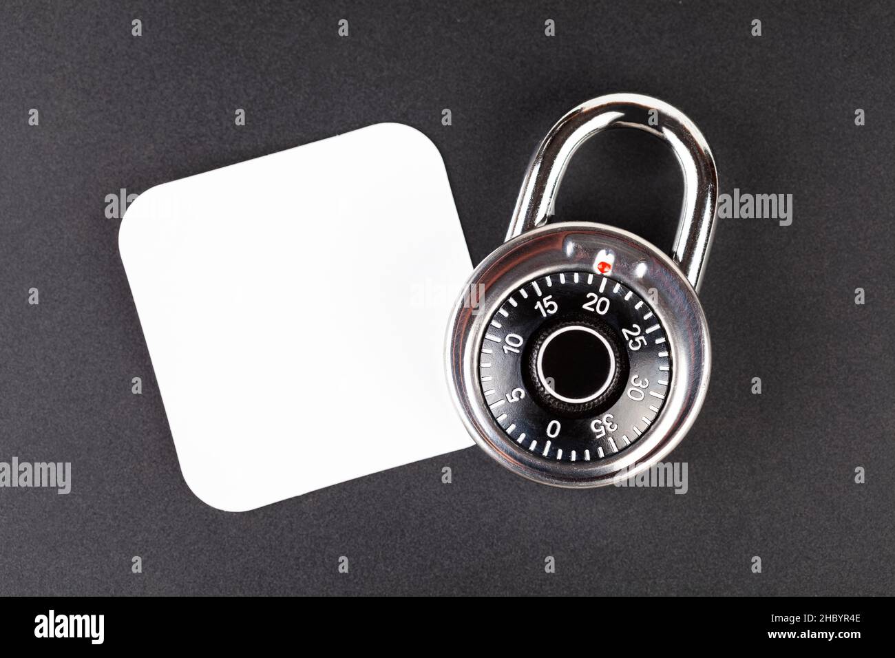 Coded padlock and a blank empty square image logo placeholder, top view Data safety and privacy, security lock, protection code encryption symbol, pas Stock Photo