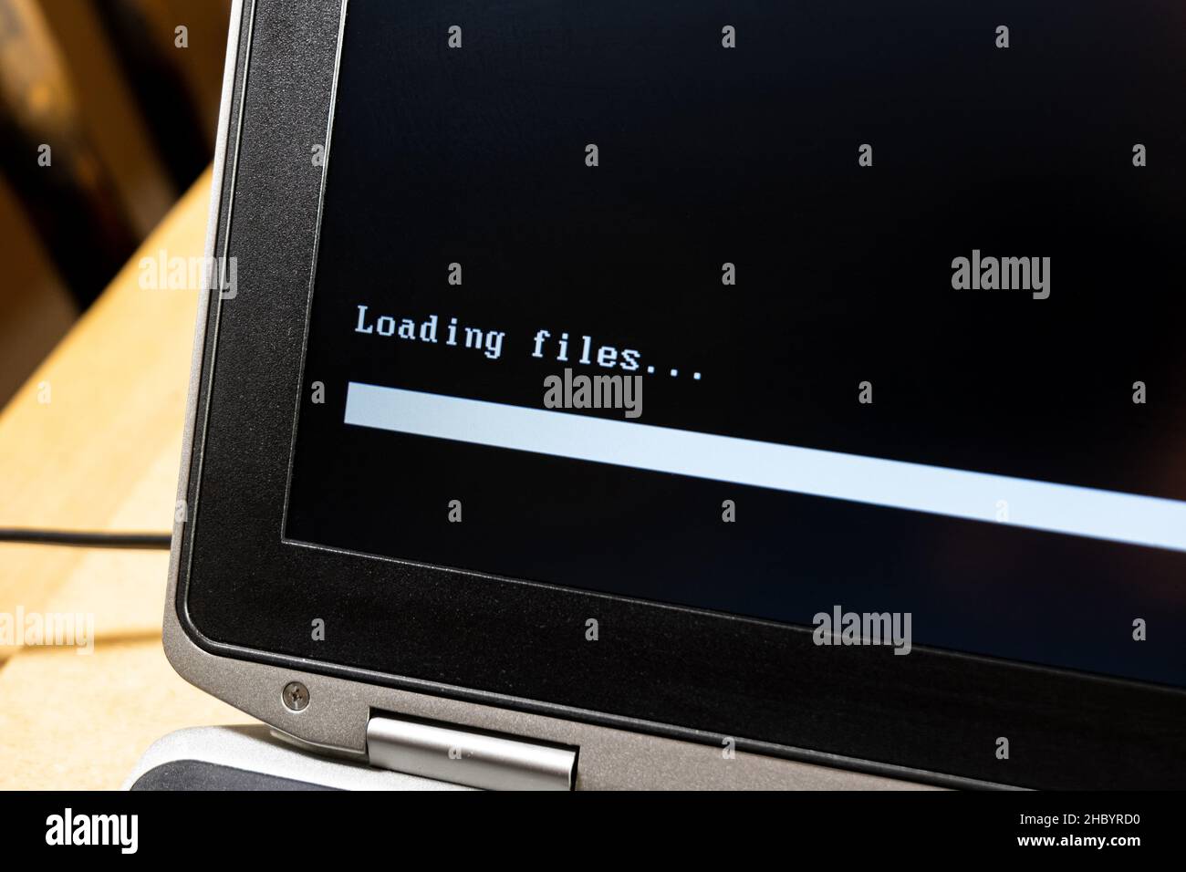 Laptop screen, computer display closeup, loading files progress bar ...