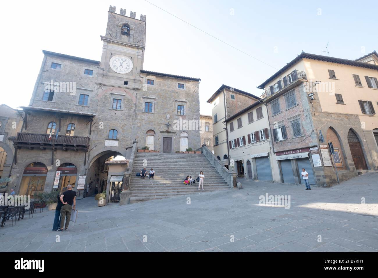 The Town Hall, clearly recognizable with its clock tower and the magnificent access staircase on the facade, Cortona, Italy Stock Photo