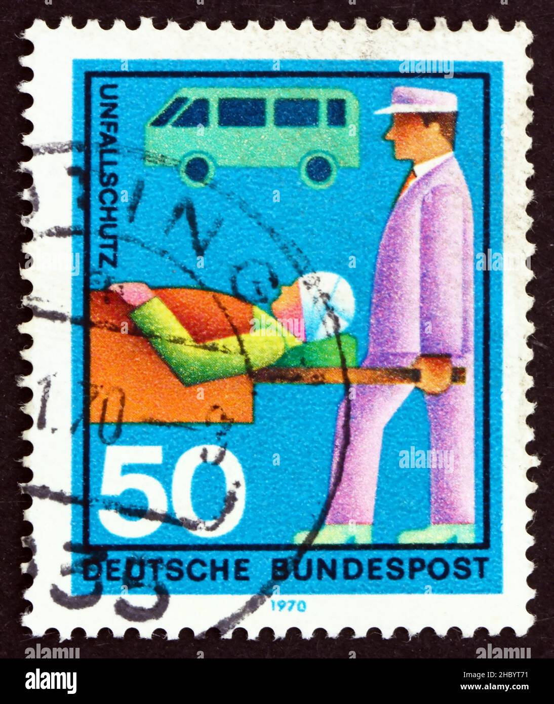 GERMANY - CIRCA 1970: a stamp printed in the Germany shows Stretcher Bearer, Casualty and Ambulance, honoring various voluntary services, circa 1970 Stock Photo