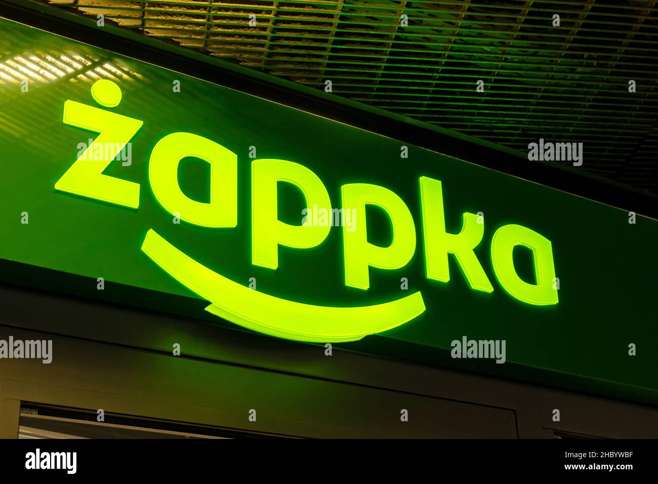 Krakow, Poland, Zappka automated convenience store, shop green signage logo, detail, closeup, night time. Polish chain store, self-service retail busi Stock Photo