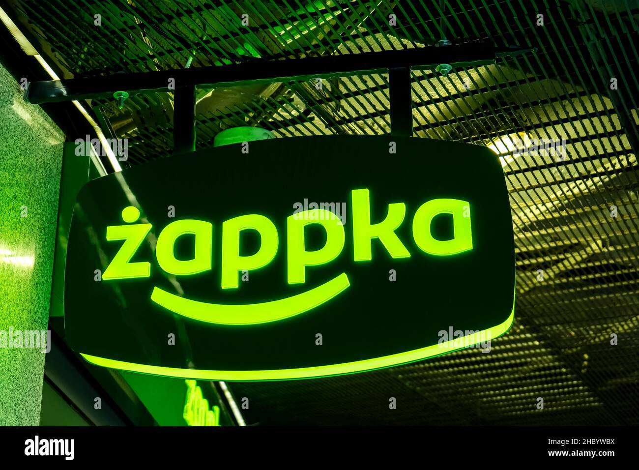 Krakow, Poland, Zappka automated convenience store, shop green signboard logo, detail, closeup, night time. Polish chain store, self service retail co Stock Photo
