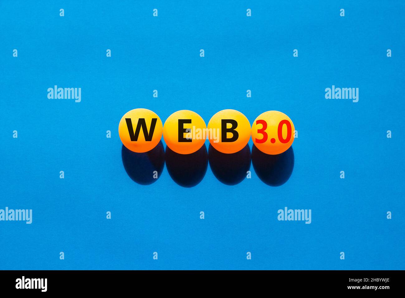 WEB 3.0 symbol. Yellow tennis balls with concept words WEB 3.0. Beautiful blue table, blue background, copy space. Business, technology web3 and WEB 3 Stock Photo