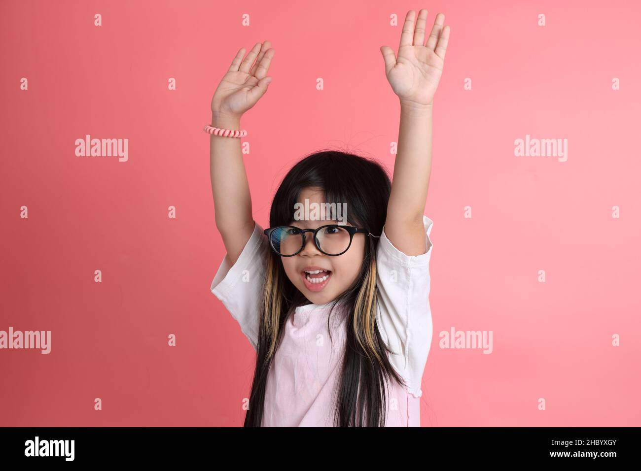 The young Asian girl portrait on the pink background Stock Photo - Alamy