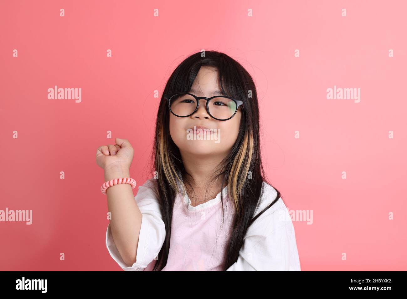The young Asian girl portrait on the pink background Stock Photo - Alamy