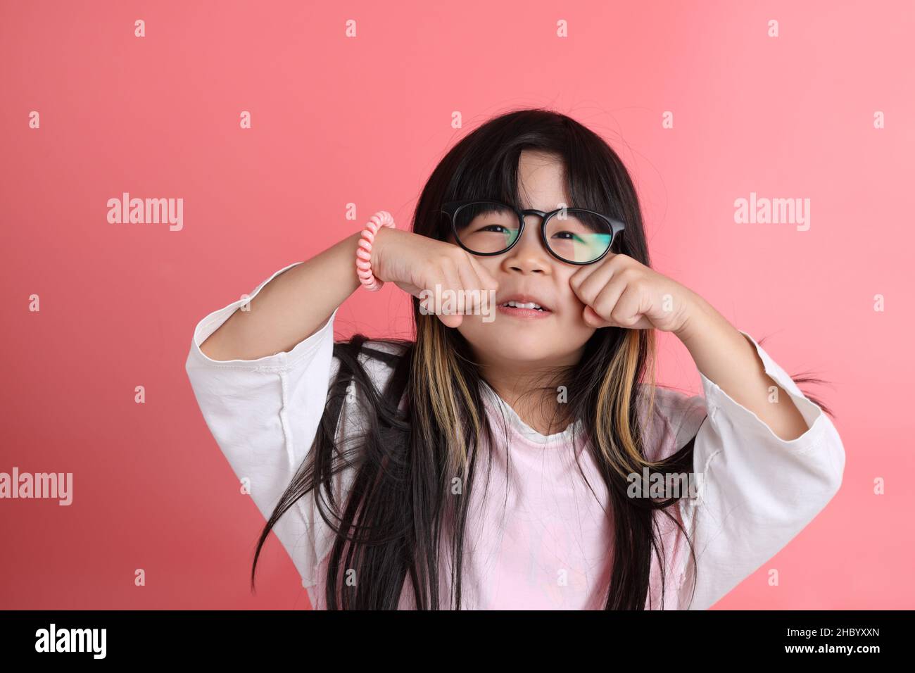 The young Asian girl portrait on the pink background Stock Photo - Alamy