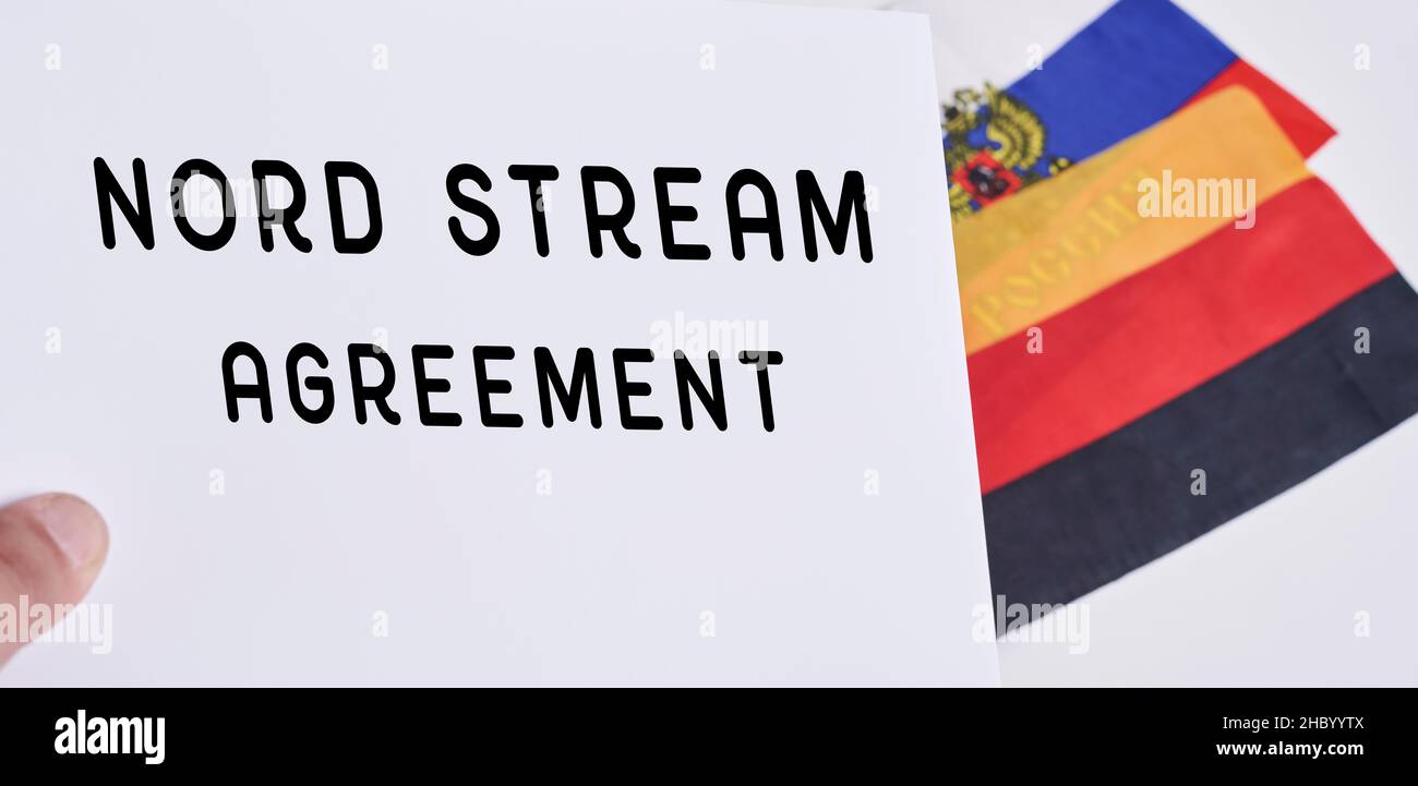 Nord Stream agreement between Germany and Russia. Flags of Russia and Germany and Nord Stream 2 contract Stock Photo