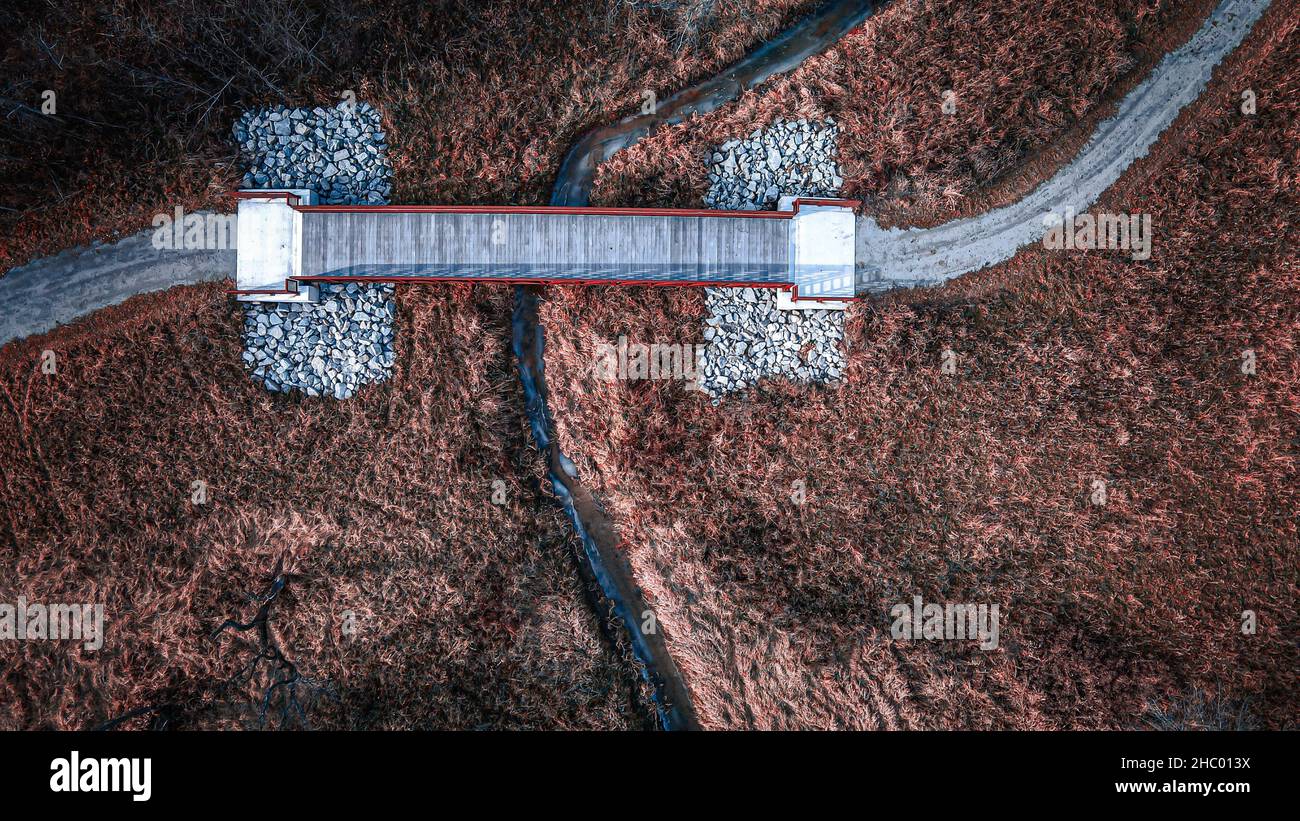 Walking trail bridge over stream Stock Photo - Alamy