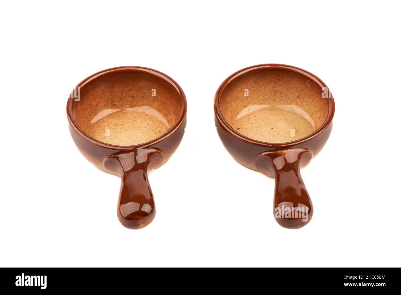 Two ceramic cocotte makers for baking isolated on white background. Copy space. Stock Photo