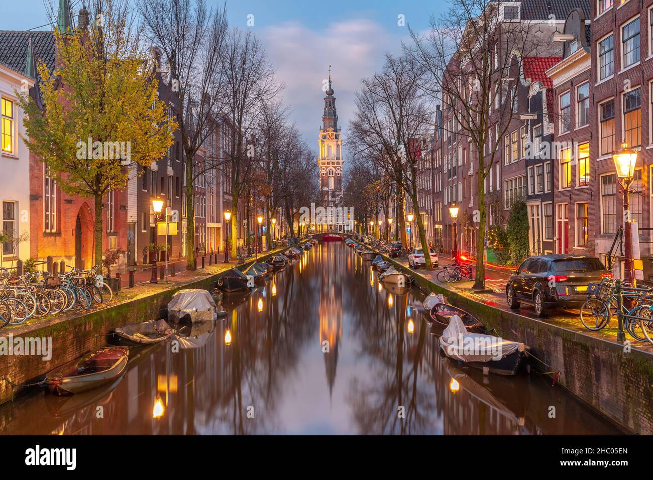 Evening Amsterdam canal Groenburgwal with Zuiderkerk, southern church, Holland, Netherlands. Stock Photo