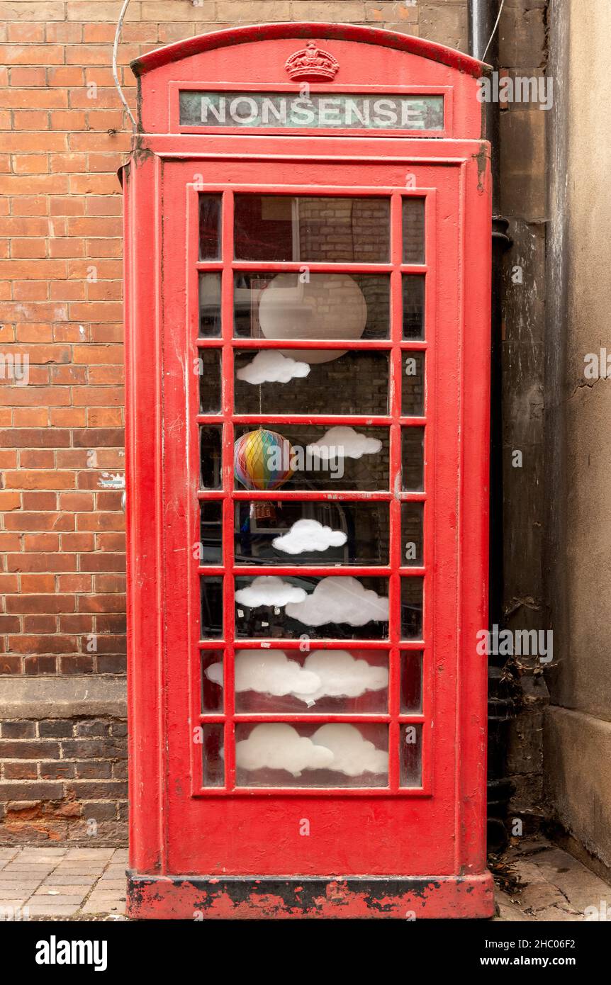 Old K6 Grade II listed red telephone box converted into art installation outside the Story Museum in Pembroke Street, Oxford, Oxfordshire, England, UK Stock Photo