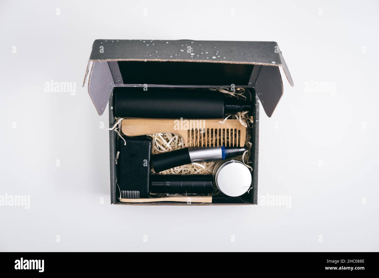 Men self care kit, black gift box with male beauty care products and