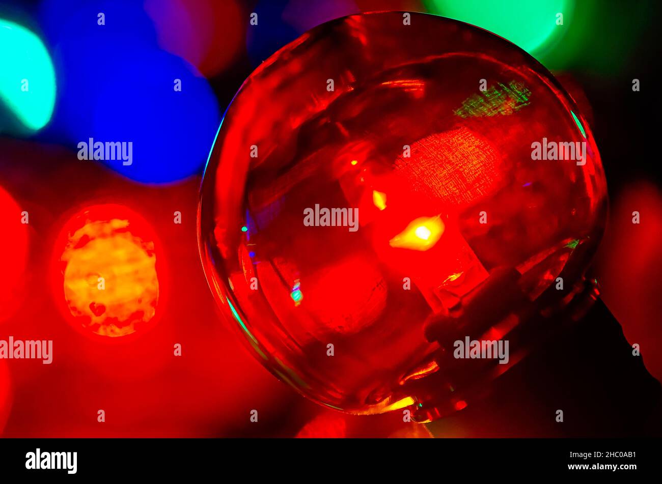 Colored globe lights lay on a table, Dec. 27, 2017, in Coden, Alabama. Globe-style string lights can be used inside or outdoors for a festive touch. Stock Photo