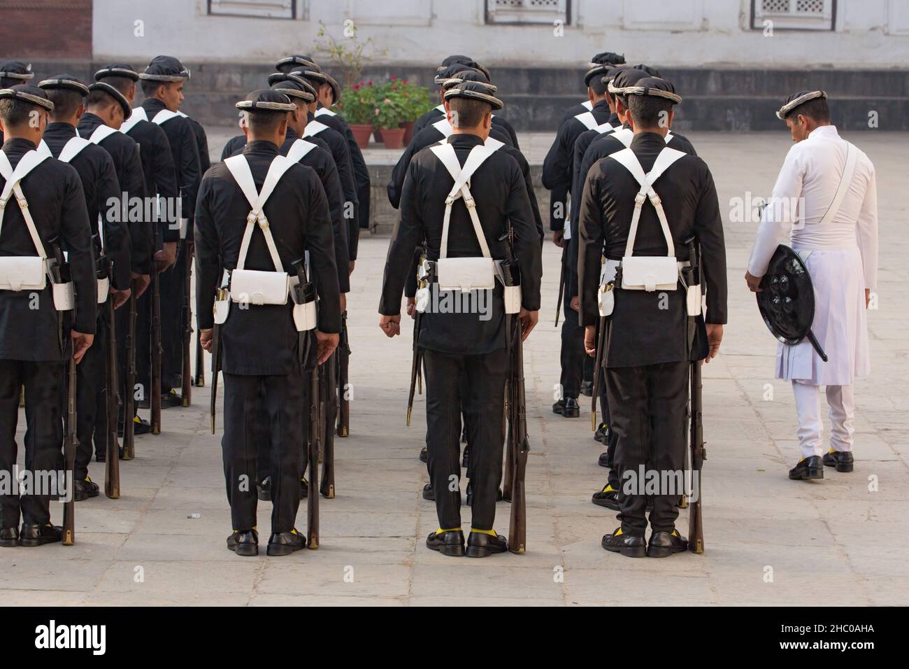 The Gurkha troop commander inspects his soldiers before ceremonial duty at the Hanuman Dhoka Palace, Kathmandu, Nepal.  These soldiers perform ceremon Stock Photo