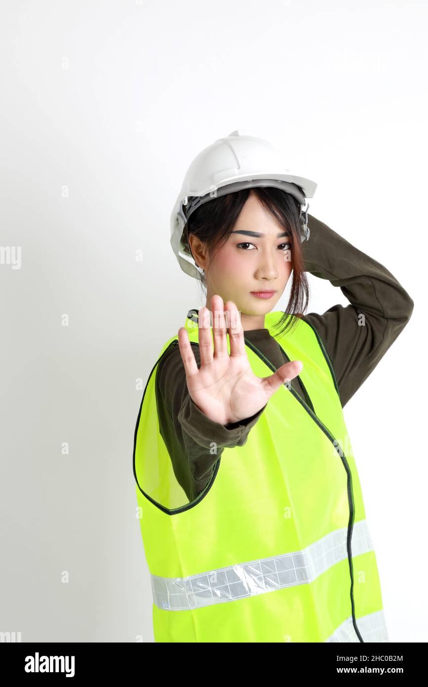 The Asian womna standing on the white background. Stock Photo