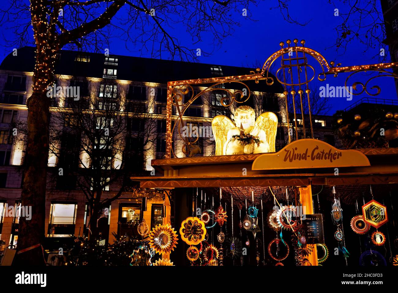 Beautiful Christmas stand selling wind cathcers at the traditional 'Engelchen-Markt' Christmas market in Düsseldorf, Germany. Stock Photo