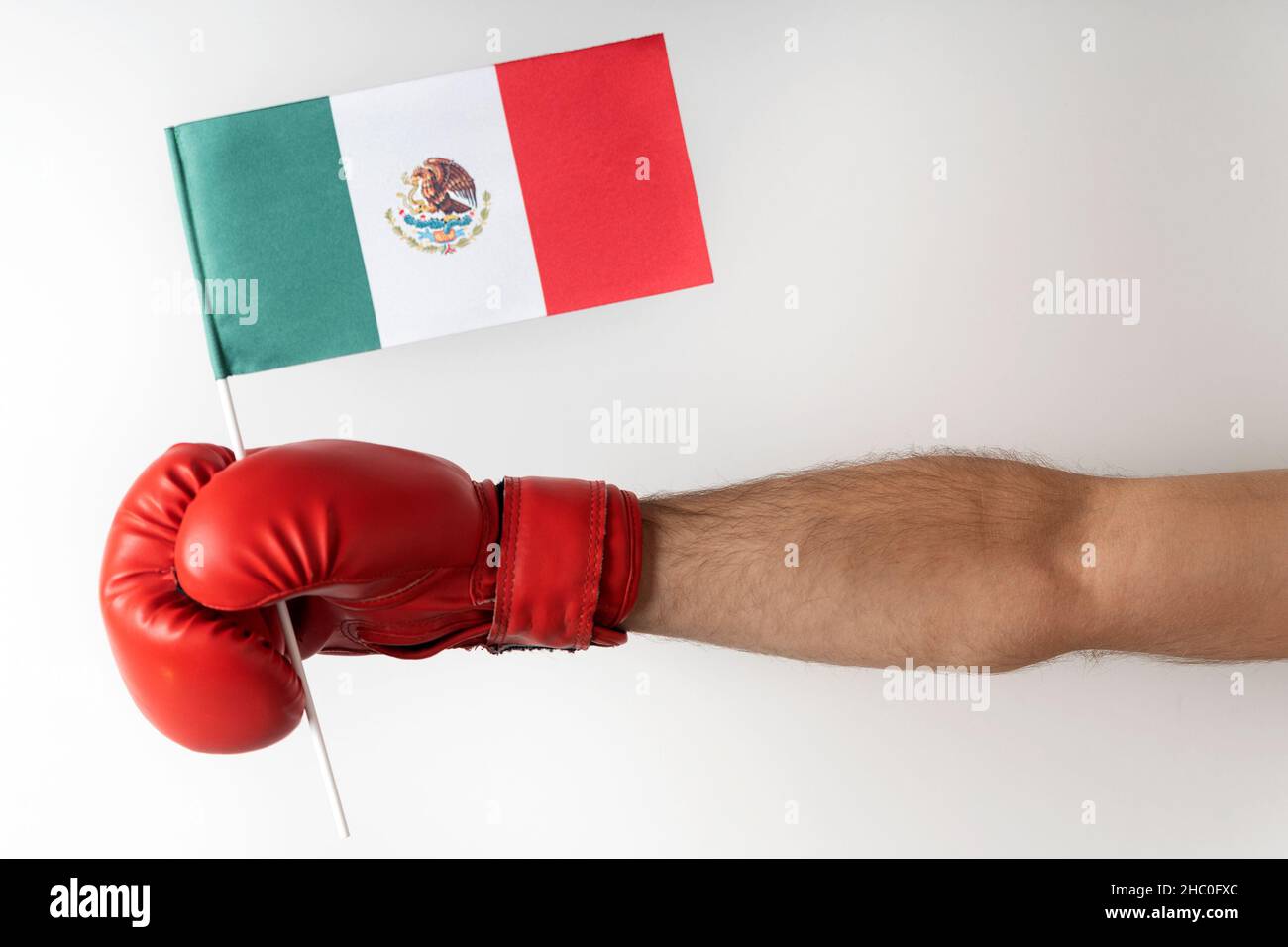 Boxing glove with Mexican flag. Boxer holds flag of Mexico. White background Stock Photo Alamy