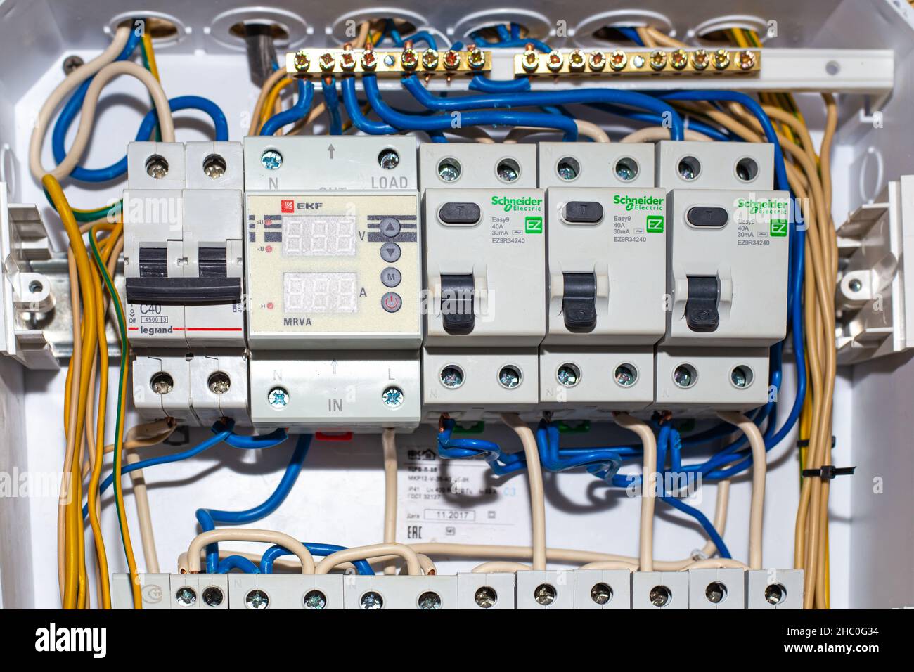 Electrical panel with switches and wires. Conducting electricity to the house. Russia, Anapa - 11.07.2020. Stock Photo